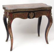 Early 19th century red boulle fold-top card table of serpentine form with ebonised border and