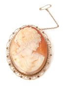 Large cameo brooch, the oval shaped shell cameo depicting a profile of a classical lady in a 9ct