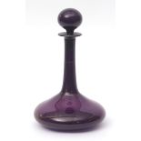 Bristol Amethyst glass decanter of shaft and bulb form with globular stopper, remaining traces of