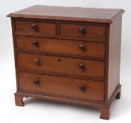 Mahogany apprentices chest with moulded edge over two short and three full width graduated drawers