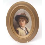Continental KPM style porcelain plaque painted with a head and shoulders portrait of a young boy,