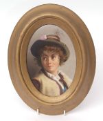 Continental KPM style porcelain plaque painted with a head and shoulders portrait of a young boy,