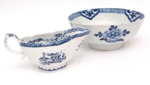 English porcelain sauce boat, the reeded body decorated with blue printed designs in Lowestoft