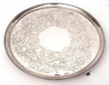 George III circular tray with cast and applied beaded border to a C-scroll and lattice chased