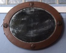 Arts & Crafts oval wall mirror by Liberty of London, (see ivorine plaque verso), the copper frame