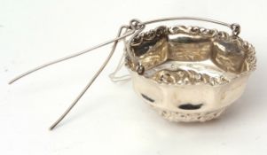 Mid-19th century American tea strainer of basket form with applied C-scroll border, embossed body
