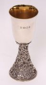 Elizabeth II silver parcel gilt goblet, the gilt lined and polished bell shaped bowl to a leaf