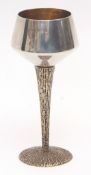 Elizabeth II silver parcel gilt goblet, the polished body with gilt lined interior to a textured and