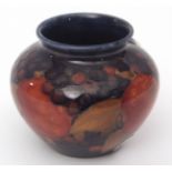 Early 20th century Moorcroft squat vase, shape M55, decorated with the Pomegranate pattern, green