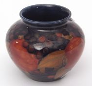 Early 20th century Moorcroft squat vase, shape M55, decorated with the Pomegranate pattern, green