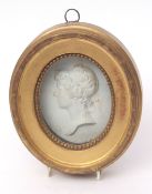 Continental biscuit porcelain oval medallion modelled as a head adnd shoulders portrait of a