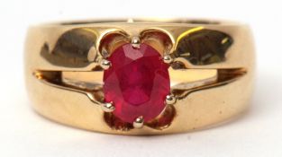 Ruby single stone ring, the oval shaped ruby 2.15ct approx, raised between pierced shoulders to a