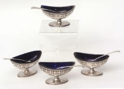 Four George III open salts, each of oval form with reeded rims, pierced gallery and erased