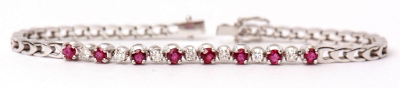 18ct white gold ruby and diamond set bracelet, the centre alternate set with eight circular cut