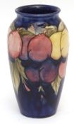 Mid-20th century Moorcroft cylindrical vase decorated with the Wisteria pattern, signature in blue