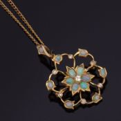High grade yellow metal opal and diamond open work pendant, the centre with a brilliant cut