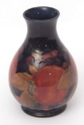 Early 20th century Moorcroft baluster vase decorated with the Pomegranate pattern, 12cms high,
