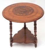 Oak occasional table of nautical interest, circular top raised on three ring turned supports