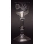 18th century wine glass, the bucket bowl etched with bird and foliage on a plain balustroid stem