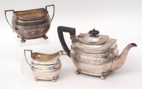 Edward VII three piece tea set comprising tea pot, sugar basin and milk jug, each of oval form