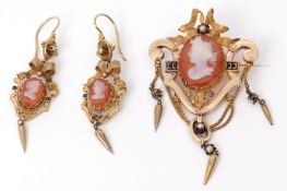 Victorian hardstone cameo brooch and earring set, each with carved cardelian cameos in scroll frames