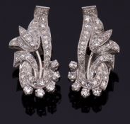 Pair of precious metal Art Deco style diamond cocktail earrings, a design of a flower in a basket,