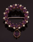 Amethyst and diamond brooch, designed as an openwork circular wreath, alternate set with small