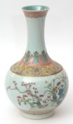 Porcelain bottle vase finely enamelled in famille rose palette with a continuous band of various