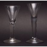 Two late 18th/early 19th century conical wine glasses, plain form, one with air drop stem, 15 and 16