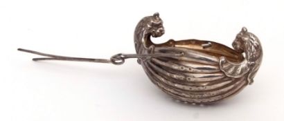Early 20th century American tea strainer, modelled in the form of a double ended longboat with