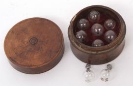 Late 19th century boxed collection of seven (plus two) hygrometer glass proof beads