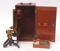 Early 20th century patinated and lacquered brass monocular microscope, unsigned, the open foot to