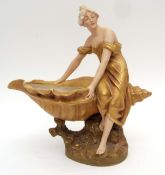 Royal Dux Art Nouveau dish modelled as a maiden holding a seashell, in typical bronze colours, 32cms