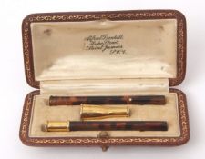 Dunhill circa 1920 cased cigarette holder, two-piece design, tortoiseshell and yellow metal