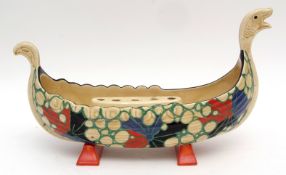 Clarice Cliff flower holder modelled as a Viking longboat with flower holder to interior, the boat