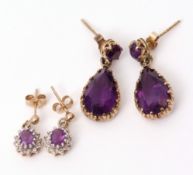 Pair of amethyst drop earrings, the pear cut faceted amethysts framed in 9ct gold mounts, with a