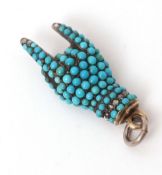 Turquoise and diamond "hand" pendant, the folded finger hand set throughout with small turquoise