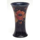 Mid-20th century Moorcroft cylindrical vase decorated with the Pomegranate pattern, factory mark and