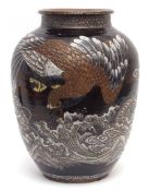 Large Japanese red clay pottery vase, thickly glazed with an eagle confronting a dragon above