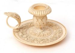 Late 19th century European carved ivory chamber stick, with urn shaped sconce with flared and fluted