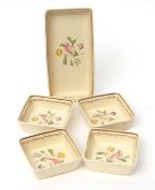 Set of six pin trays and a larger tray with floral decoration, largest 20cms long