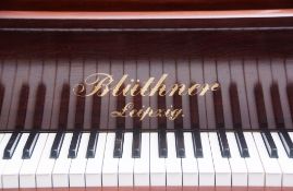 Bluthner rosewood cased grand piano, serial number 73285, raised on heavy balustered supports with