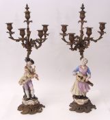 Pair of gilt metal five-sconce candelabra, each with integral stands with 19th century Meissen