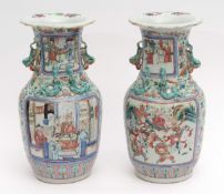 Pair of Canton style Chinese porcelain vases decorated in famille rose enamels with typical panels
