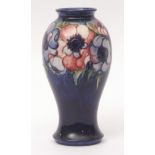 Mid-20th century Moorcroft baluster vase decorated with anemones on a dark blue ground, signature