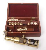 Late 19th century mahogany cased lacquered brass drum microscope of typical form with screw