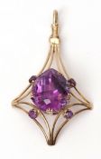 Stylised 9ct stamped amethyst openwork pendant, the large pear shaped amethyst 21 x 18mm, set at