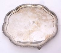 George VI silver tray of lobed circular form with cast and applied Celtic border to a plain field