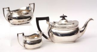 George V three piece tea set of polished rectangular form and comprising tea pot, sugar basin and