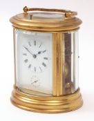 Late 19th century French gilt and lacquered brass oval carriage alarm clock, with push repeat,